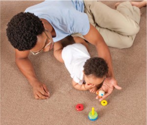 Dad and baby on carpet - Image courtesy by: hometolife.co.za