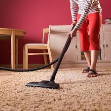 Hoovering carpet - Image courtesy by: thebesthomeimprovementguide.com