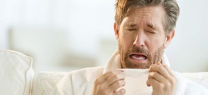 Man Sneezing Carpet and Allergies